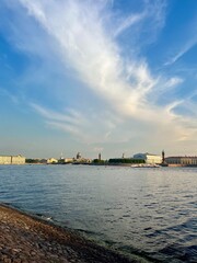 city river view, river in the city center, blue sky, white clouds, summer