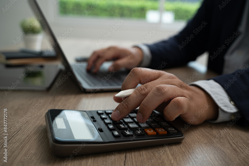 Wall mural calculate accounting business man using calculator business man using calculator close-up