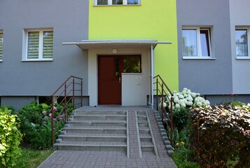 The entrance to the staircase with the close door - view of the old renovated apartment block © Gold Picture