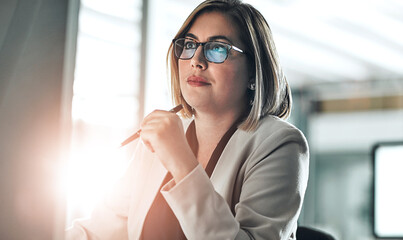 Businesswoman, thinking and reading on computer for research, information and glasses in office. Female lawyer, idea and review details on internet for planning, legal advice and strategy for case