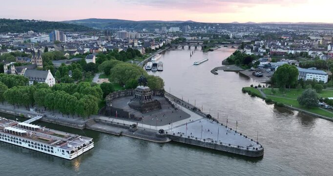 Aerial drone view of the deutsche Eck, monument in the city of Koblenz, Germany at sunset. Birds eye view.