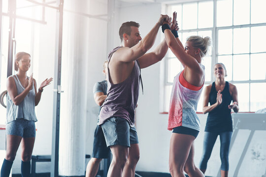 Victory, gym and team with high five, fitness and clapping for success, athlete and celebration for sports. Congratulations, happy and applause for exercise, practice and people together for workout
