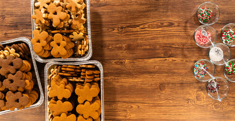 Making Festive Gingerbread Sandwiches on Rustic Wooden Table
