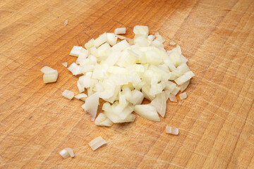 Onion cuts isolated, chopped white onion, vegetable small cubes