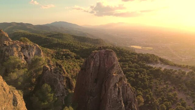 Man rock climbing aerial view of sportsman rapelling mountain in La Panocha, el Valle Murcia, Spain woman rapel down a mountain climbing a big rock