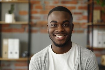 Obraz premium Happy young African American man posing for headshot at home office.