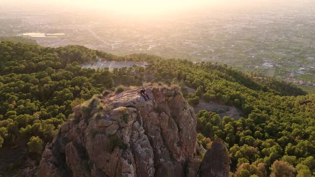 Man rock climbing aerial view of sportsman rapelling mountain in La Panocha, el Valle Murcia, Spain woman rapel down a mountain climbing a big rock