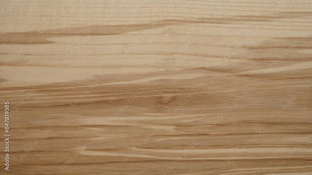 Poster a wooden surface with a grainy texture background. the wood appears to be aged and has a natural, ru