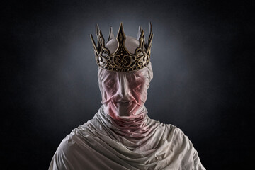 Ghost of a queen or king over dark misty background