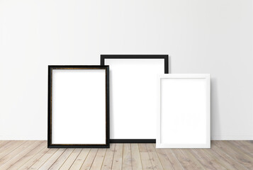 Black and white picture frame mockups on a wooden floor