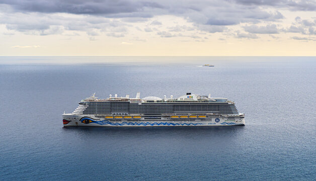 Canary islands, Spain - November 11, 2021: AIDAnova cruise ship of Carnival Corporation's German cruise line AIDA Cruises near the Tenerife coast, Atlantic ocean. AIDAnova is Green Cruising Concept.