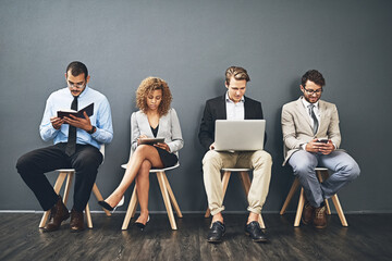 Corporate people, technology and waiting room for job interview, recruitment and career opportunity. Business group in chair for planning on laptop, tablet and phone or notebook by wall background
