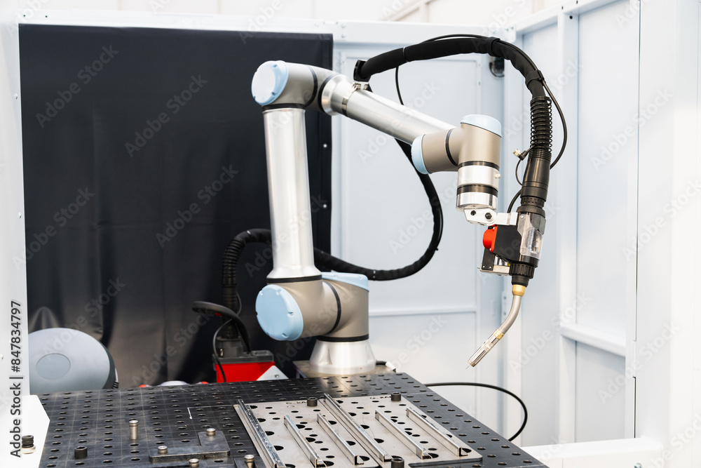 Aufkleber Automatic welding robot in a modern factory in operation