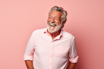 Obraz premium Portrait of a cheerful man in his 80s donning a trendy cropped top isolated on pastel or soft colors background