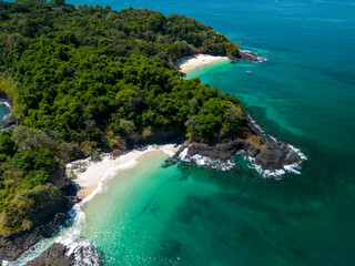 Fototapeta premium Aerial top view of Bolaños tropical island beach with white sand and emerald water, Chiriquí gulf, Chiriquí province, Panamá, Central America - stock photo