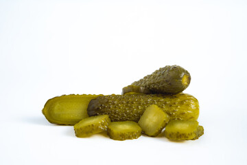 pile cucumber dill pickle cut, spears, chips and whole isolated on white background