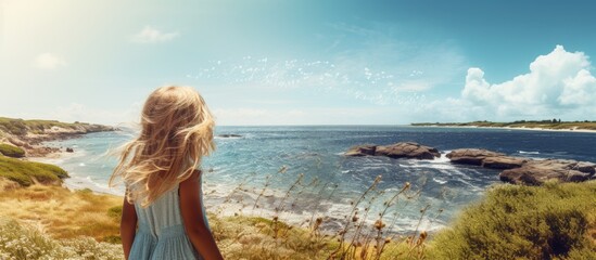 Naklejka premium young girl by the sea in summer. Creative banner. Copyspace image