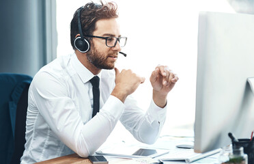 Business, man and call centre with headset on computer, help desk and customer service or online advice. Tech support, sales and network with microphone for communication, agent and consultation