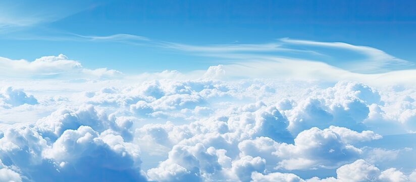 Wonderful view from the airplane window flying above the clouds Cumulus clouds with blue sky in sunny day and soft sunlight in the afternoon Nature background. Creative banner. Copyspace image
