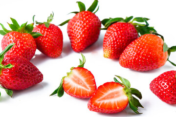 Set of ripe whole strawberries and cut strawberries isolated on white background.