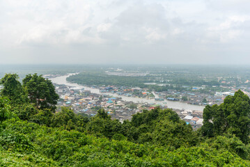 High angle view of Pak Nam Chumphon town and fisherman village with fishing boat from Khao Matsee viewpoint. Chumphon, Thailand.
