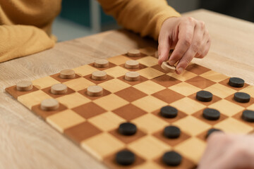 checkerboard with white and black checkers. checkers on playing field for a game. hobby