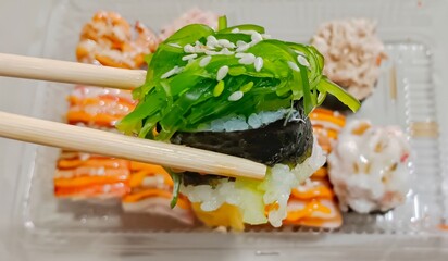 sushi with chopsticks