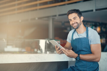 Business, apron and man with tablet, thinking and internet with digital app, service and restaurant. Online order, person and entrepreneur with tech, schedule and waiter in cafe, decision and barista