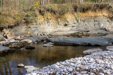 rocky river bottom in shallow water, rock fraction from rock,background for design solutions