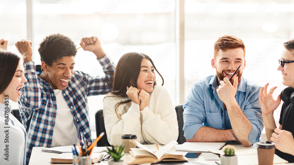 Poster a diverse group of students are seated around a conference table, engaged in laughter and animated c