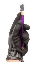 A hand wearing a work glove holds a purple glass cutter in front of a white background.