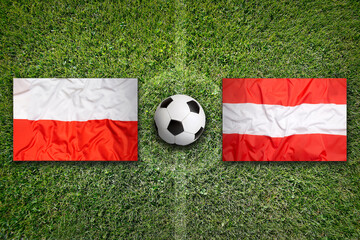 Poland vs. Austria flags on soccer field © BirgitKorber