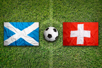 Scotland vs. Switzerland flags on soccer field