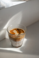 glass of coffee with milk on the table