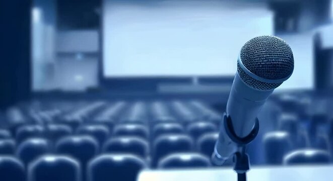 A microphone on an empty stage with blue hues representing the atmosphere for public speaking people voices