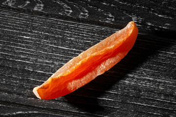 dry cantaloupe on black wood background top view