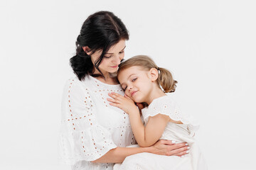 Close-up of tender touches and sensitive moment between mother and daughter.