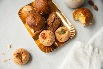 Variety of homemade Italian sweets typical for Sardinia region. Pardulas, amaretti, papassine and...