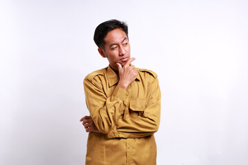 Fototapeta premium Indonesian government employees standing while glancing sideways. Isolated on white background