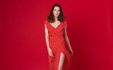 stylish woman in summer fashion trend dress on red background