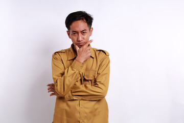 Tense face from Indonesian government employees while standing and looking at the camera