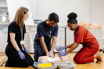 Medical Professionals Practicing CPR on a Training Dummy