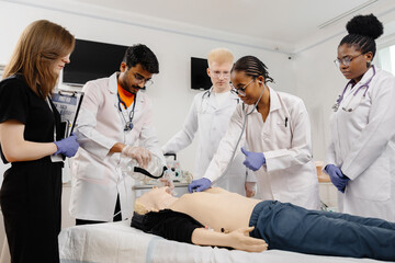 Medical Students Practicing CPR on a Dummy During a Training Session