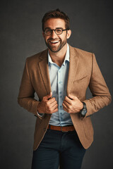 Happy, fashion and man for confident in studio with stylish, trendy and smart luxury clothes as...