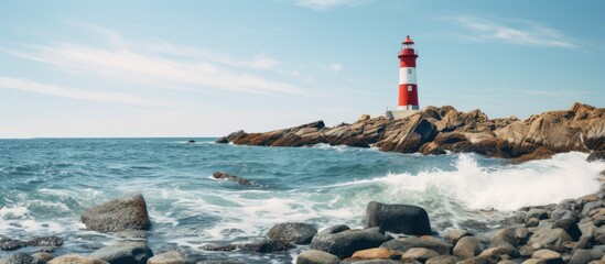 rocky coast and lighthouse against clear sea. Creative banner. Copyspace image - Powered by Adobe