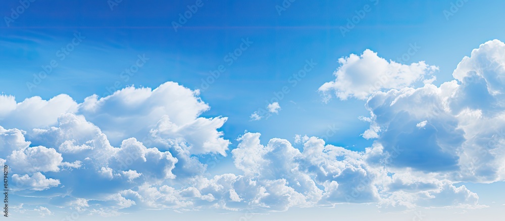 Wall mural blue sky and beautiful cloud from nature with blur background. creative banner. copyspace image