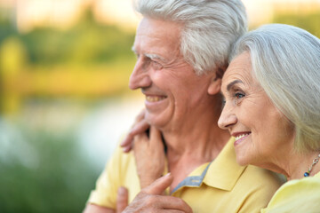 Loving mature couple in the park in summer