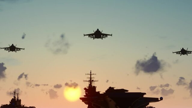 Aerial photography of aircraft carrier battle group at sea at sunset