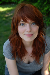 Fototapeta premium Smiling Woman with Red Hair Outdoors
