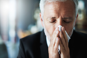 Business, blowing nose and man with tissue, bacteria and disease with burnout, sick and cold in...